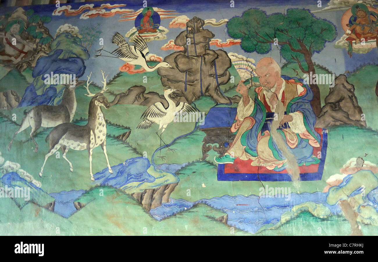 Une peinture murale de style bouddhiste tibétain traditionnel montre une sage contemplatif bienveillant. Banque D'Images