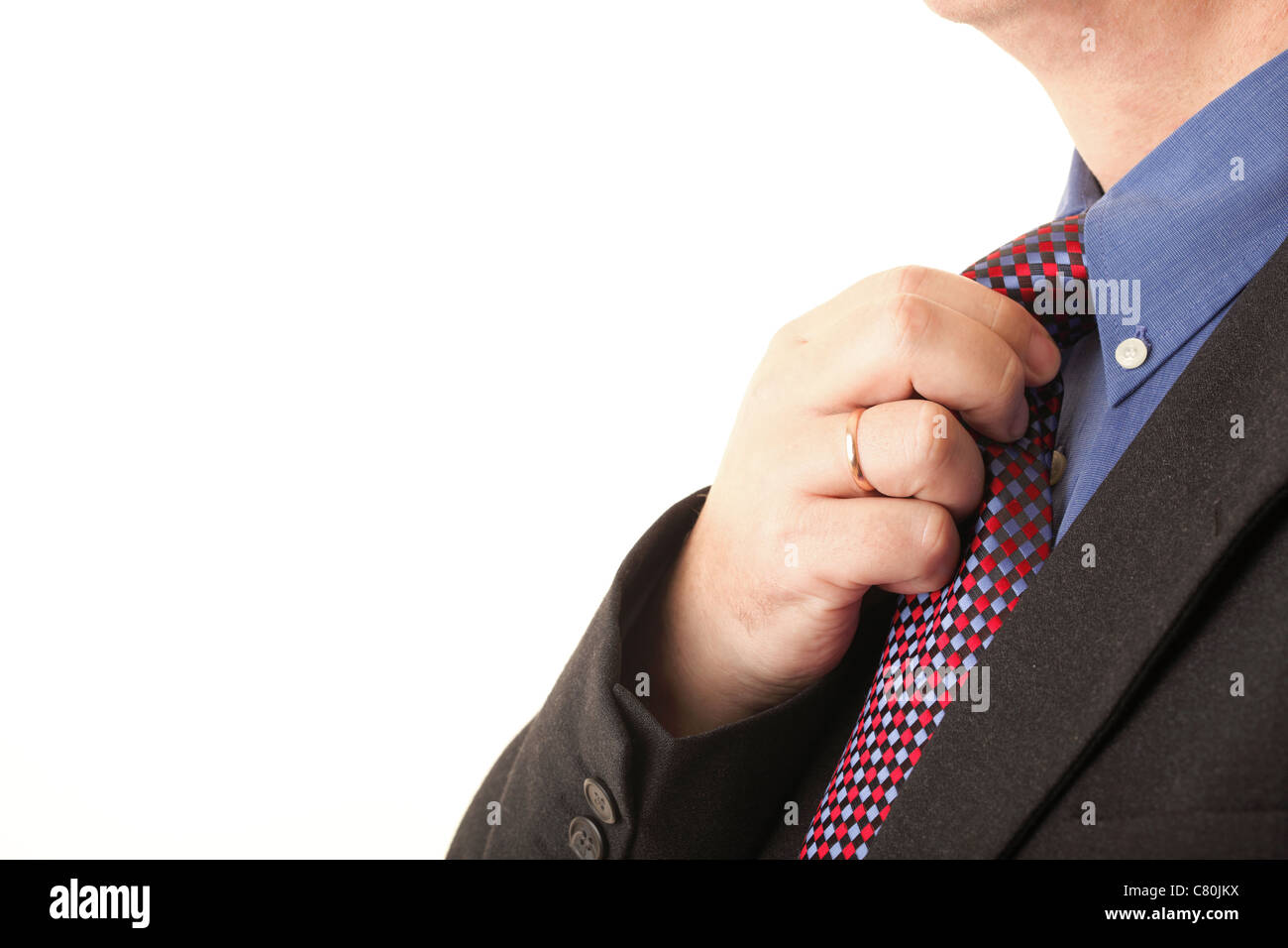 Businessman adjusting sa cravate blue Banque D'Images Businessman adjusting sa cravate blue Banque D'Images
