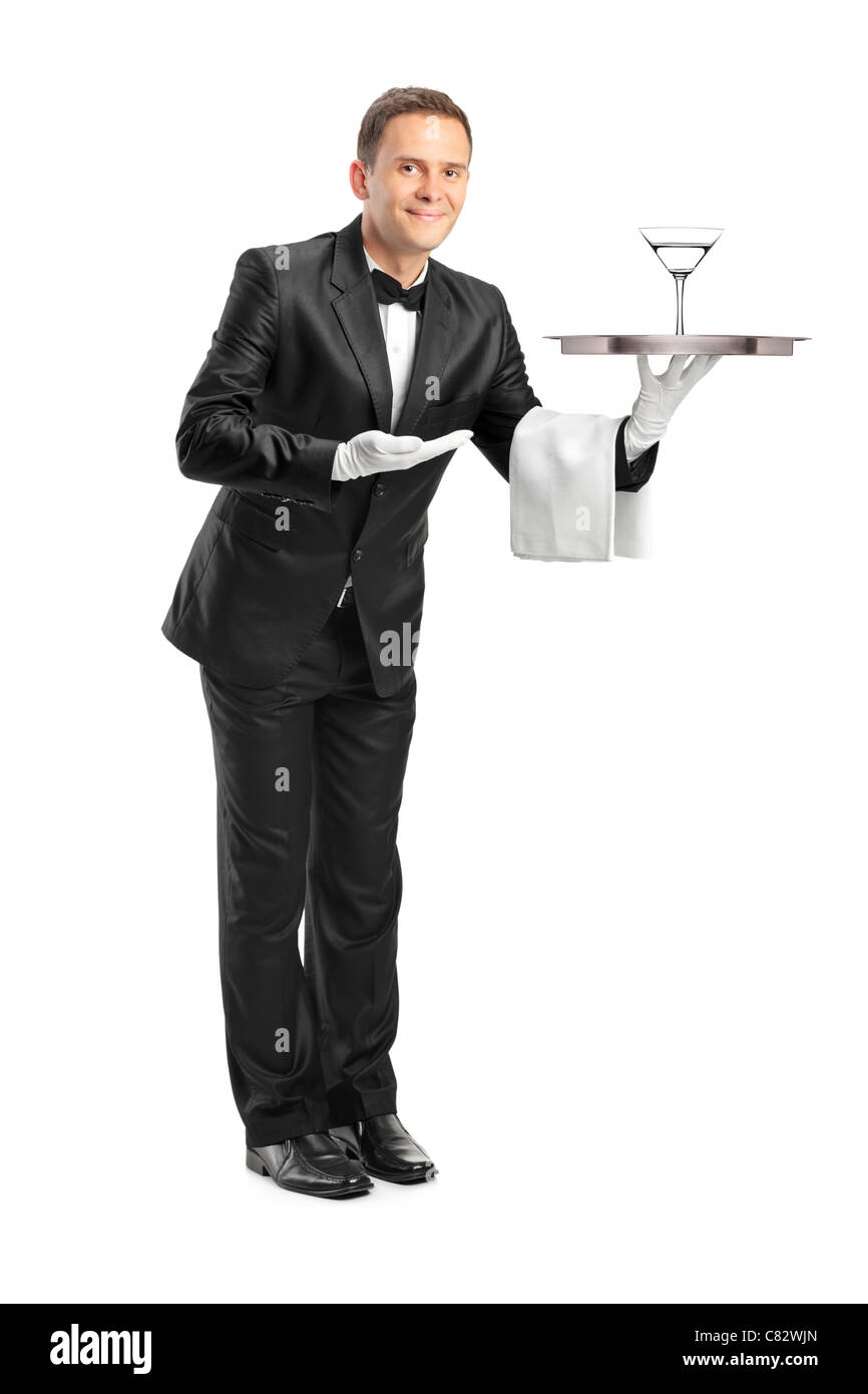 Portrait d'un garçon tenant un plateau avec un verre de cocktail sur elle Banque D'Images