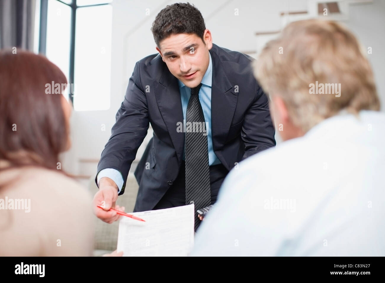 Businessman working with couple Banque D'Images