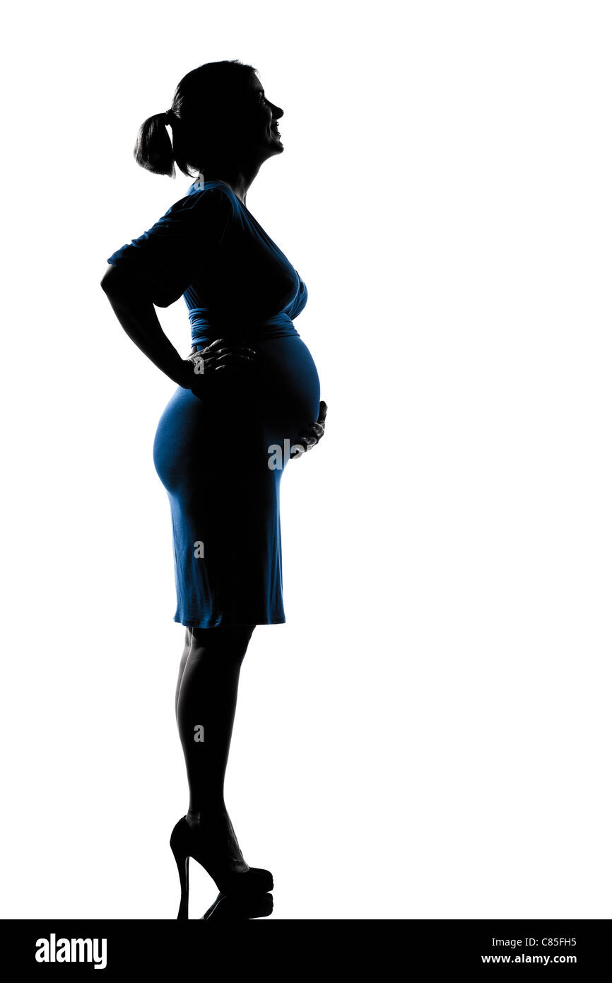 Beau portrait of happy pregnant woman en pleine longueur ossature sur studio isolé sur fond blanc Banque D'Images