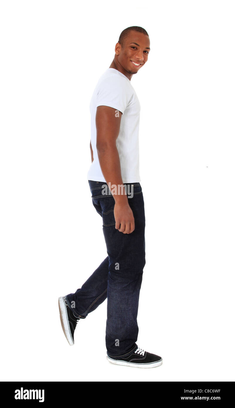 Attractive black man walking. Le tout sur fond blanc. Banque D'Images