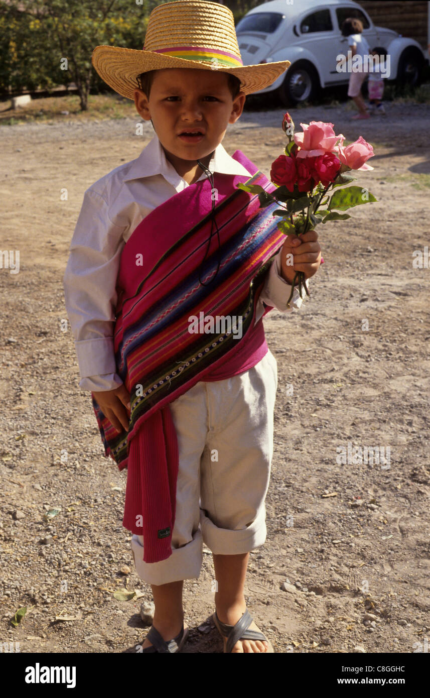 Santiago, Chili. Boy in traditional dress holding Flowers Photo Stock -  Alamy