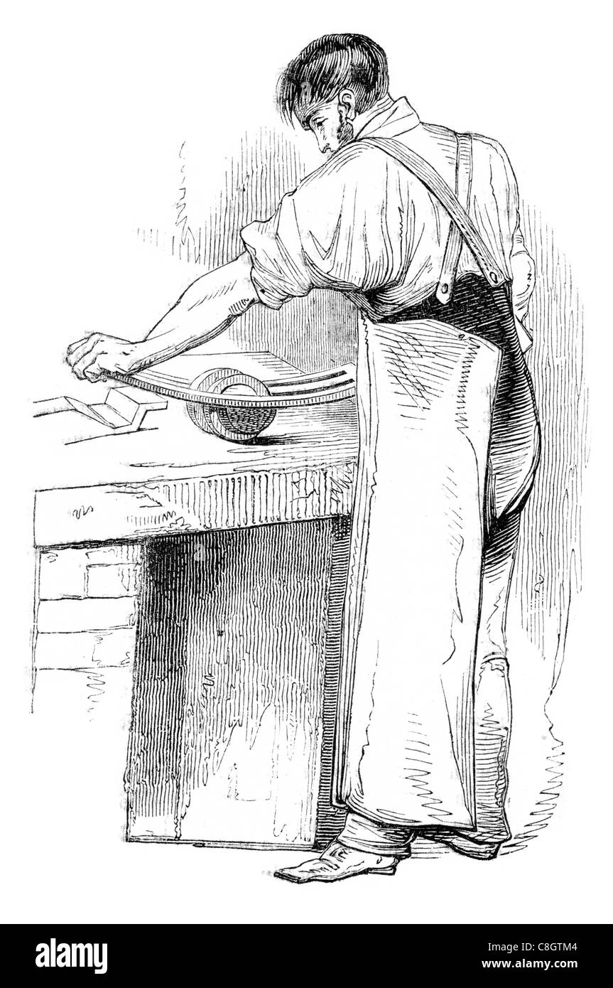 Aiguille frottant les aiguilles pointant rectifieuse rectifieuse cylindrique façonnage atelier artisan de roue panier hache étincelle sparks Banque D'Images