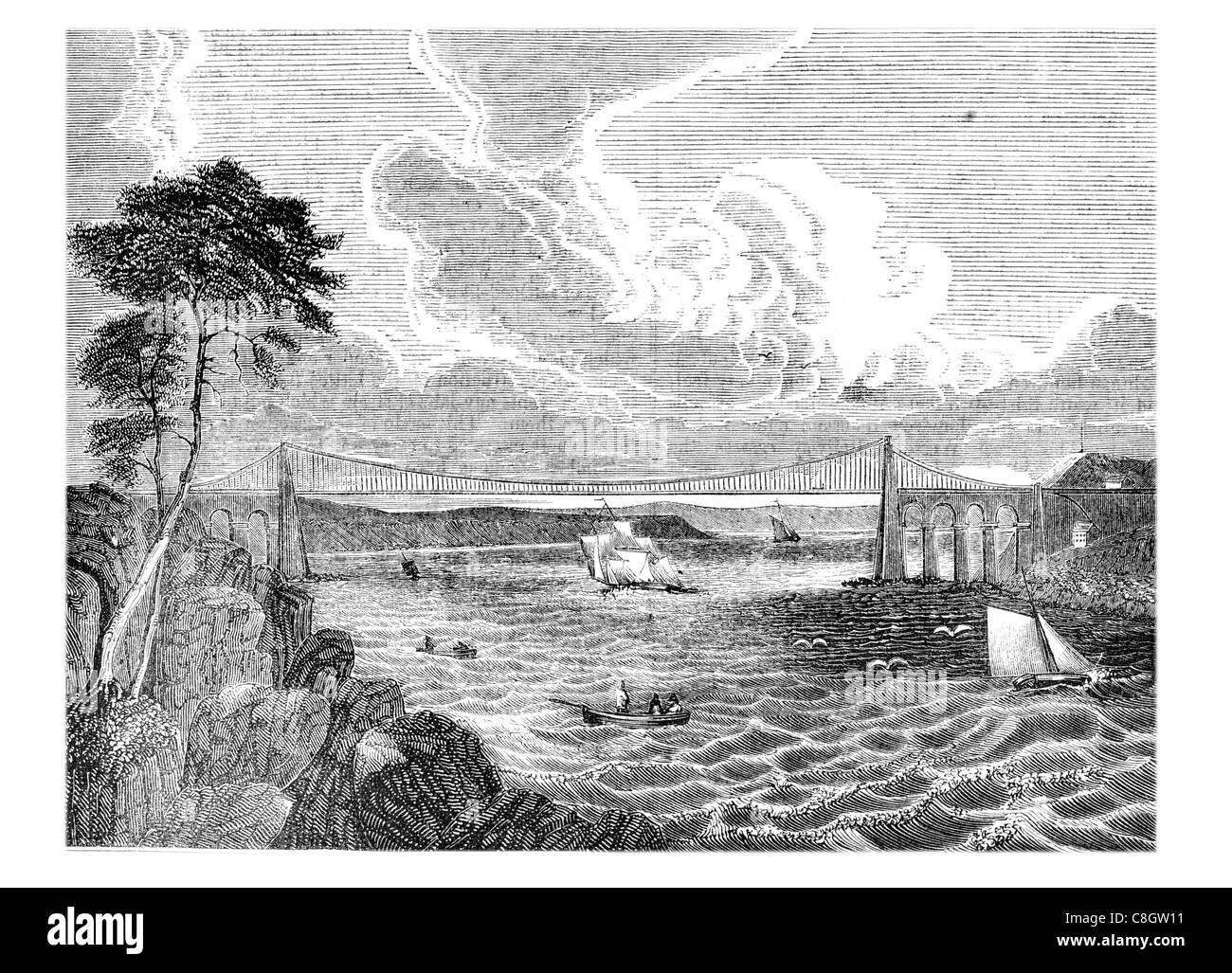 Pont suspendu de Menai Isle Anglesey au nord du Pays de Galles de la côte du détroit de Thomas Telford vagues de tempête côtière vague mer voile Voile bay Banque D'Images