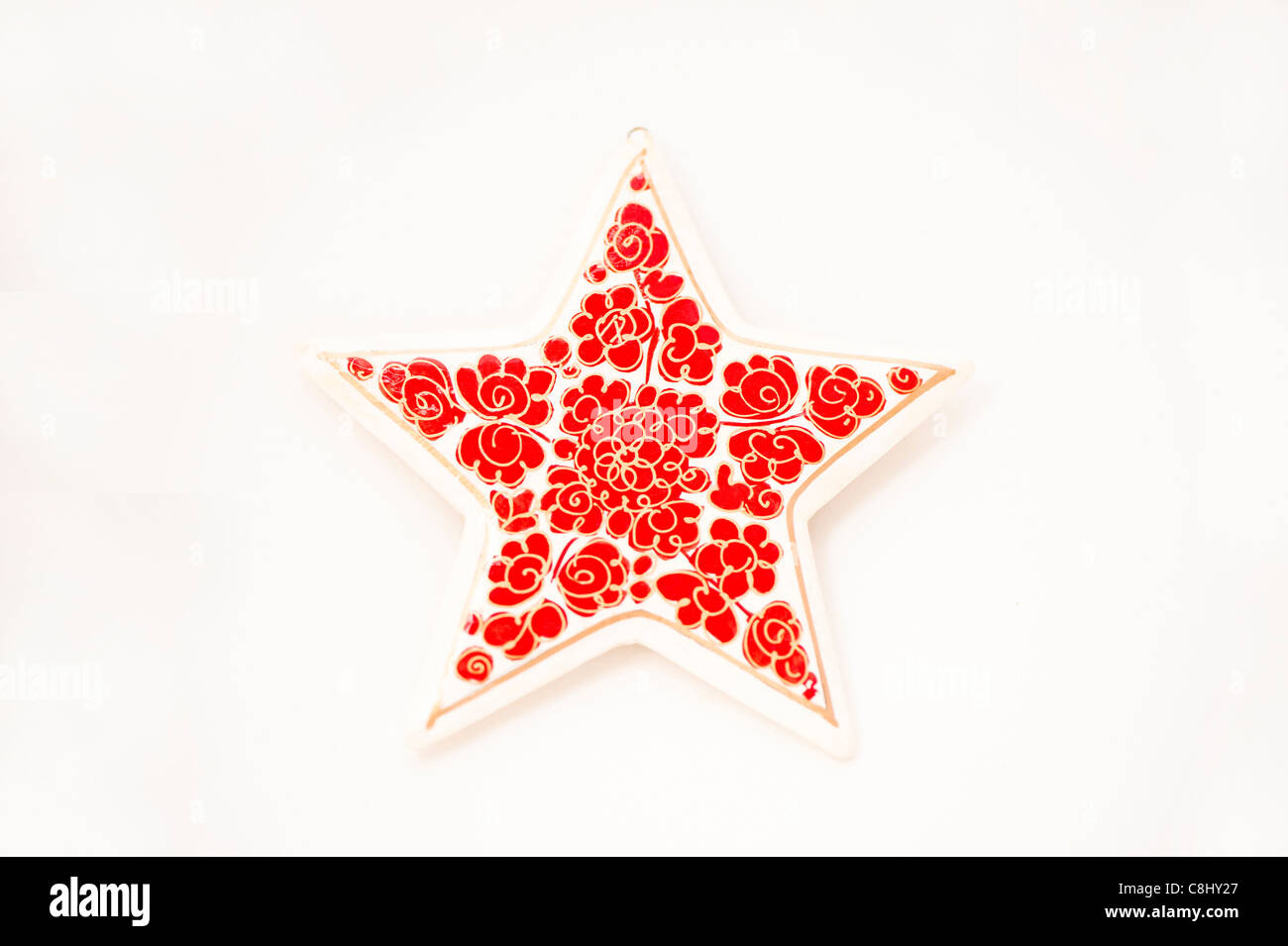 Le papier mâché star contre un fond blanc Banque D'Images