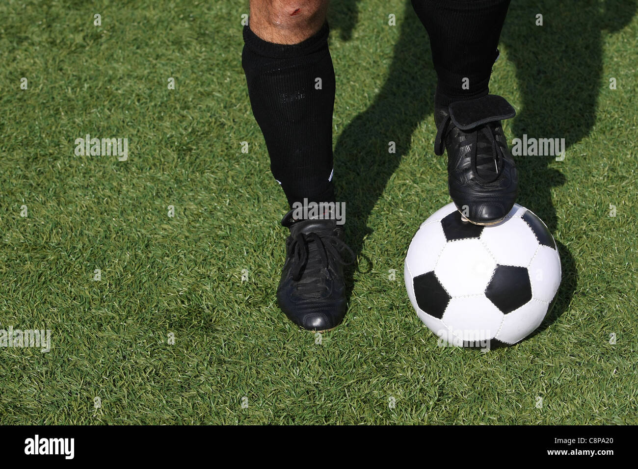 Joueur de football avec un ballon Banque D'Images