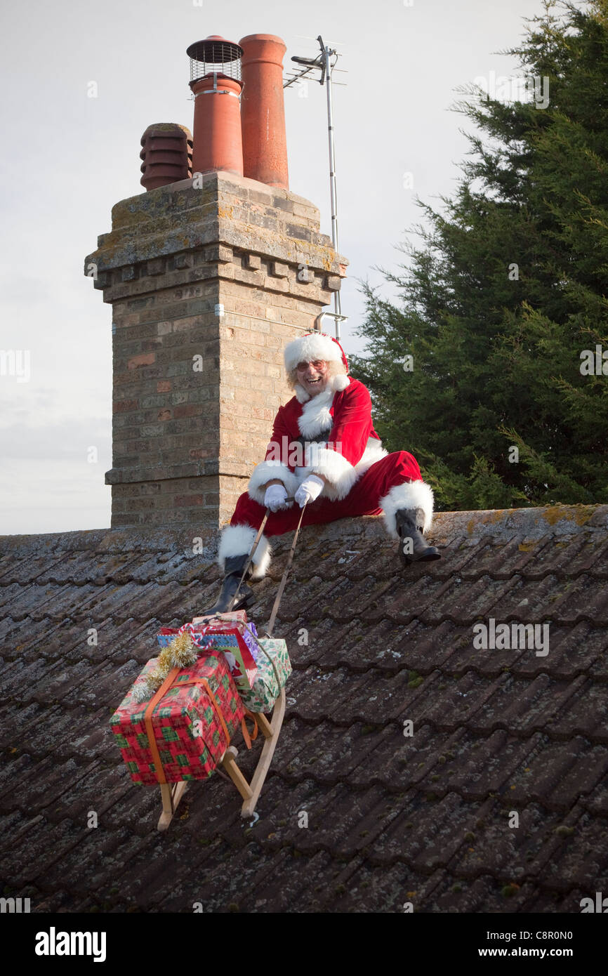 Père Noël permet son toit top magic UK Banque D'Images