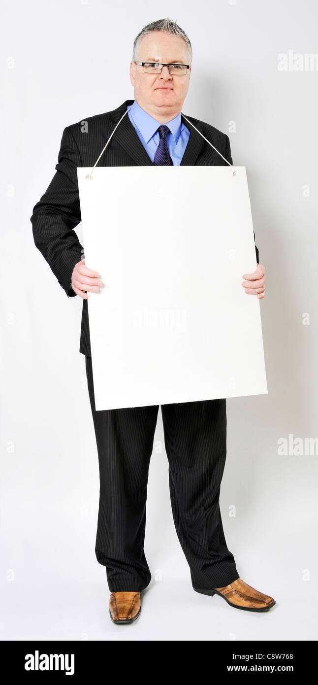 Business man holding un sandwich board Banque D'Images