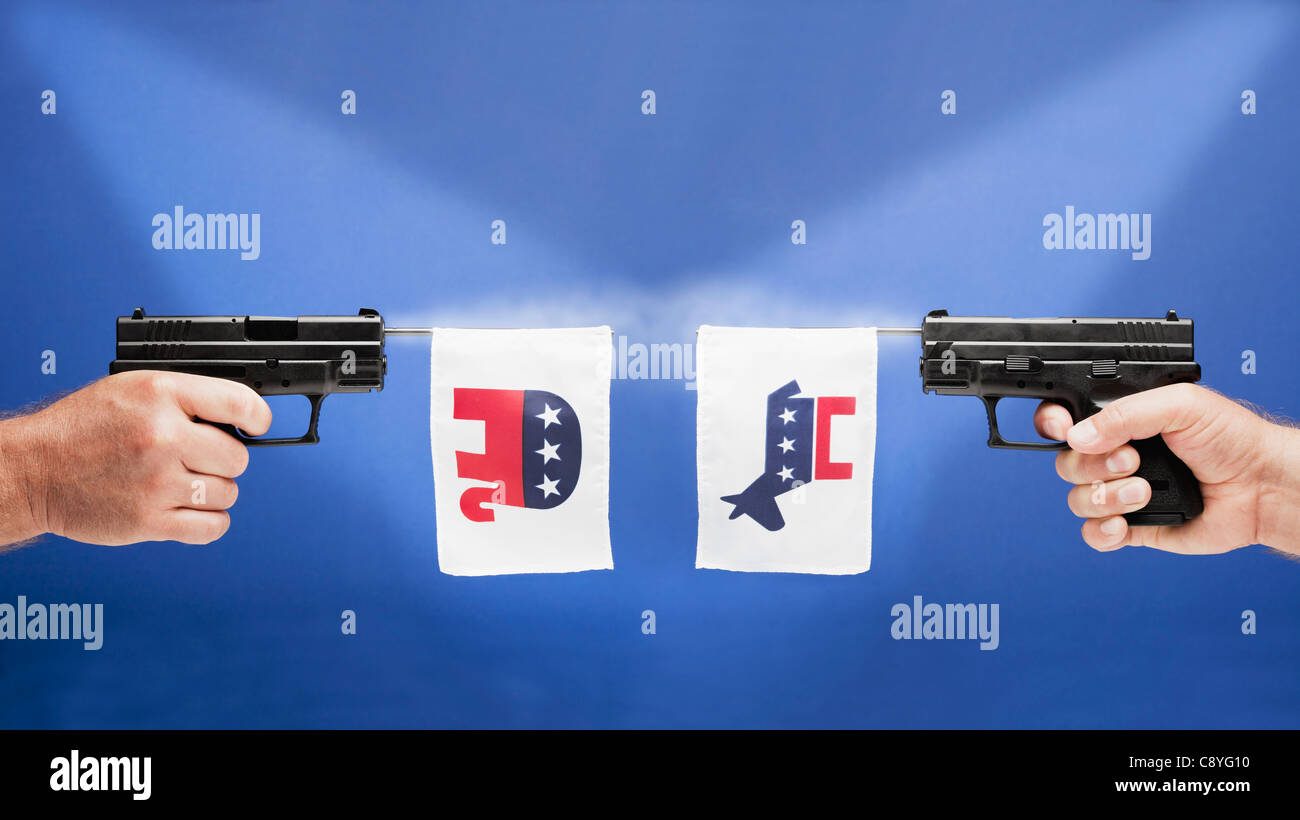 Studio shot of guns avec symboles de partis politiques Banque D'Images