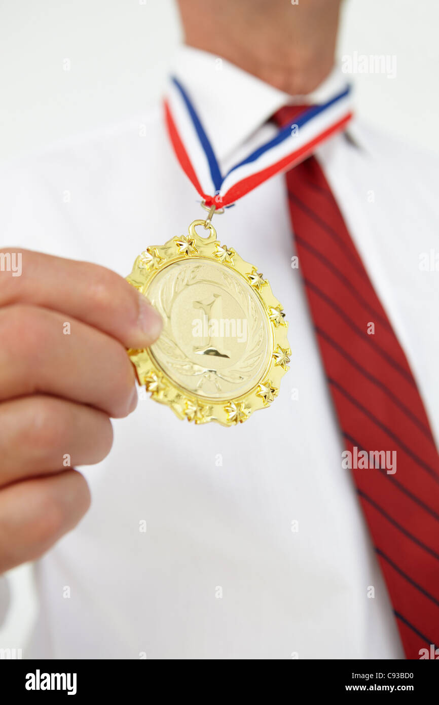 Businessman wearing medal Banque D'Images