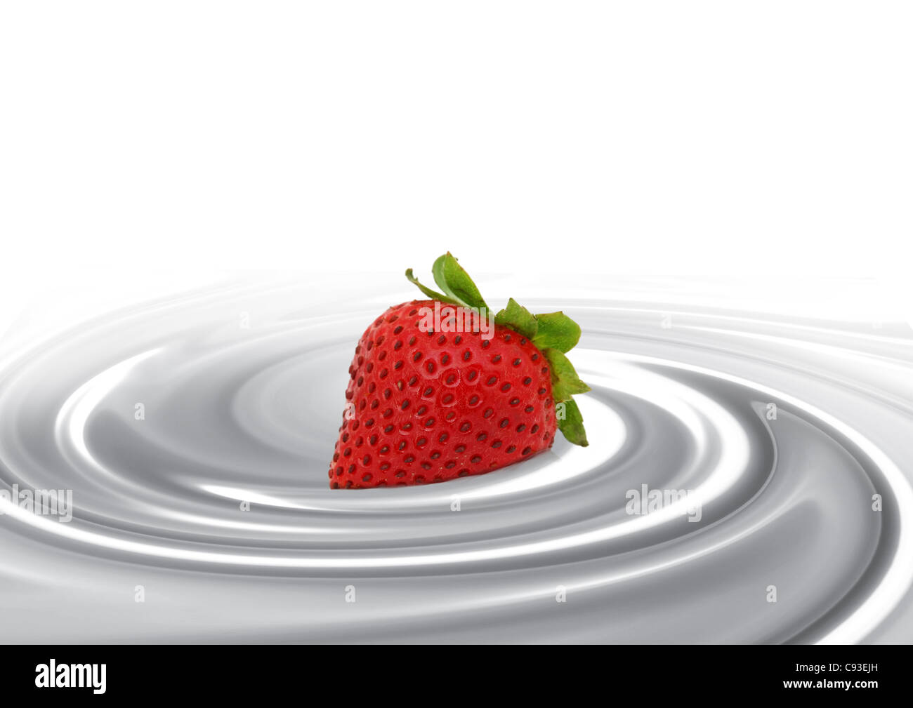 Dans le lait fraise Banque D'Images