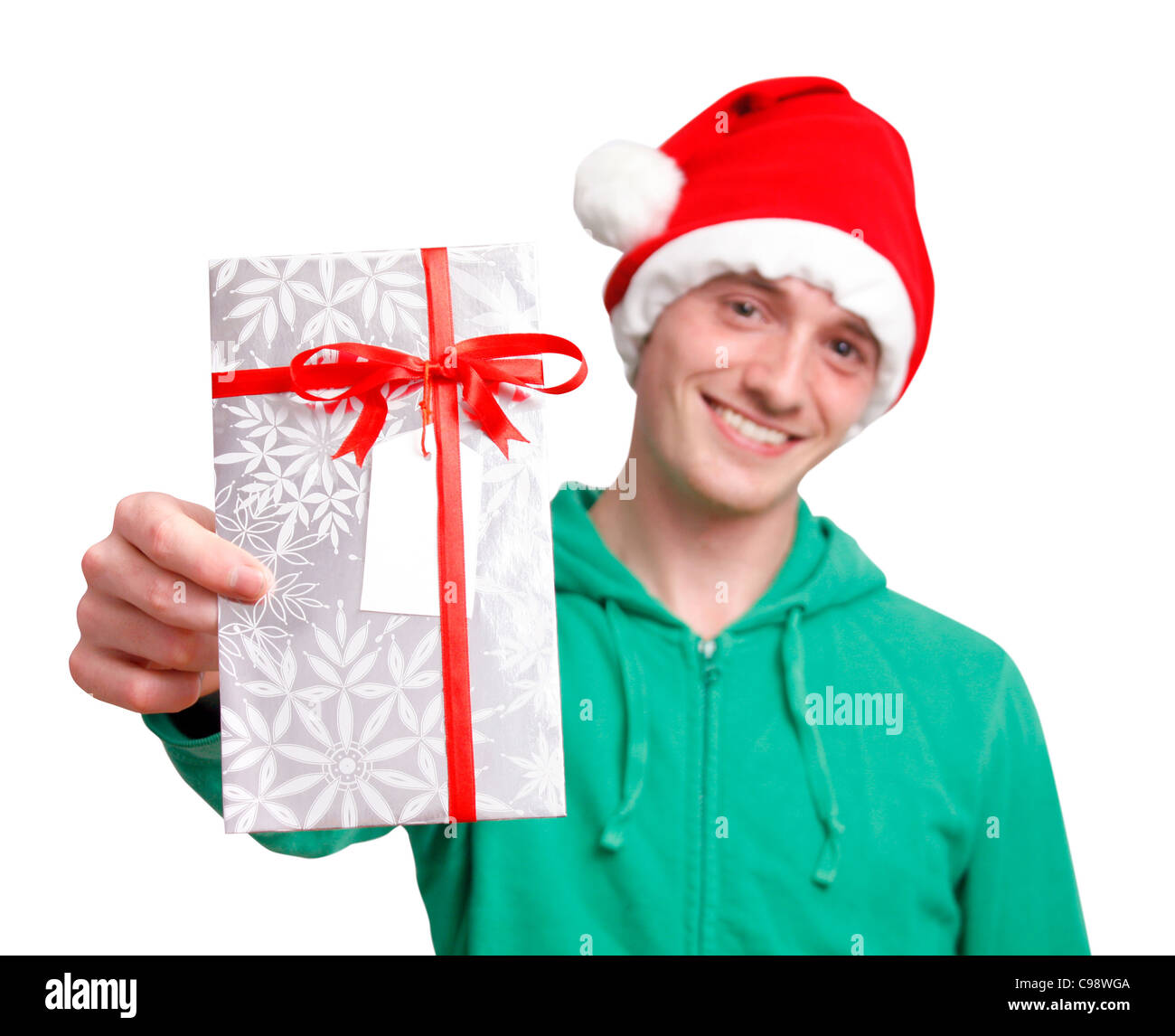 Man with santa hat holding christmas present Banque D'Images