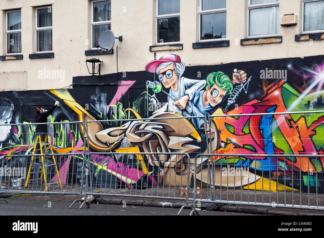 Affiche et d'artistes de graffiti à l'Upfest Bristol 2012 festival d'art urbain. 3 juin 2012, Bedminster à Bristol, Angleterre. Banque D'Images