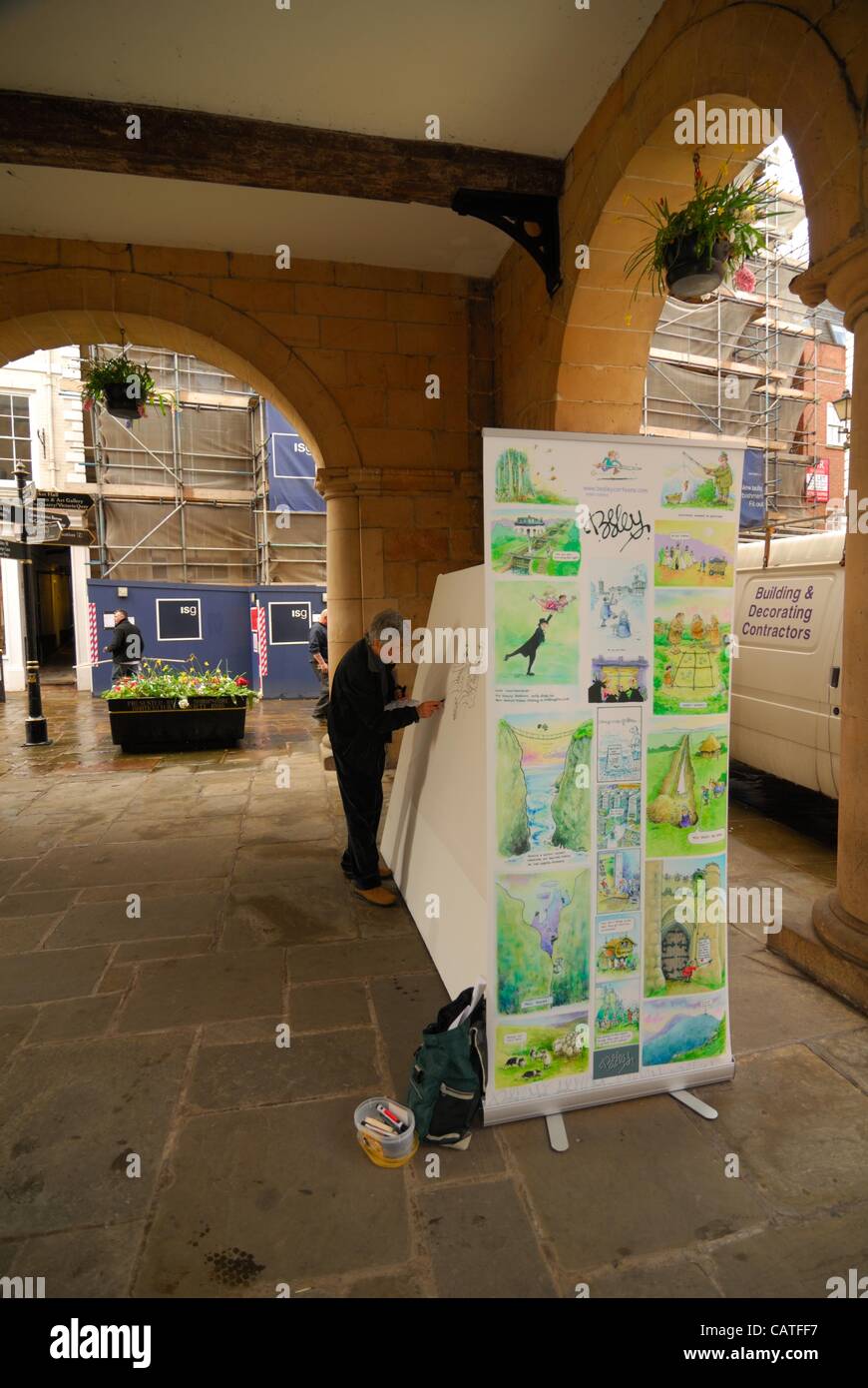 Vendredi, 20 avril, 2012, Shrewsbury, Royaume-Uni caricaturiste Rupert Besley Dessin à la place de la ville de Shrewsbury au cours du festival annuel. Banque D'Images