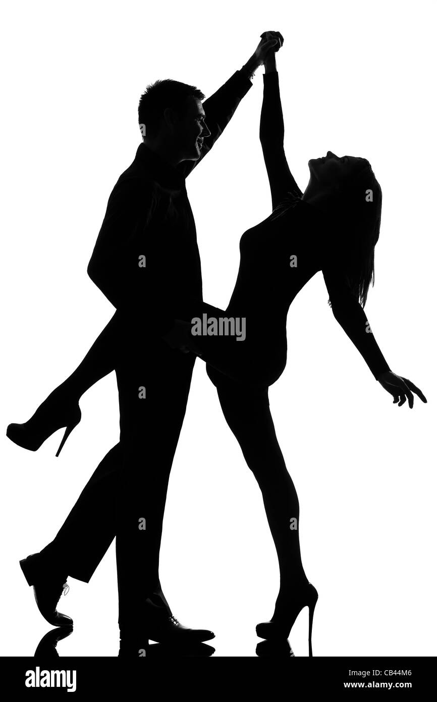 Un couple homme et femme dansant rock en silhouette studio isolé sur fond blanc Banque D'Images