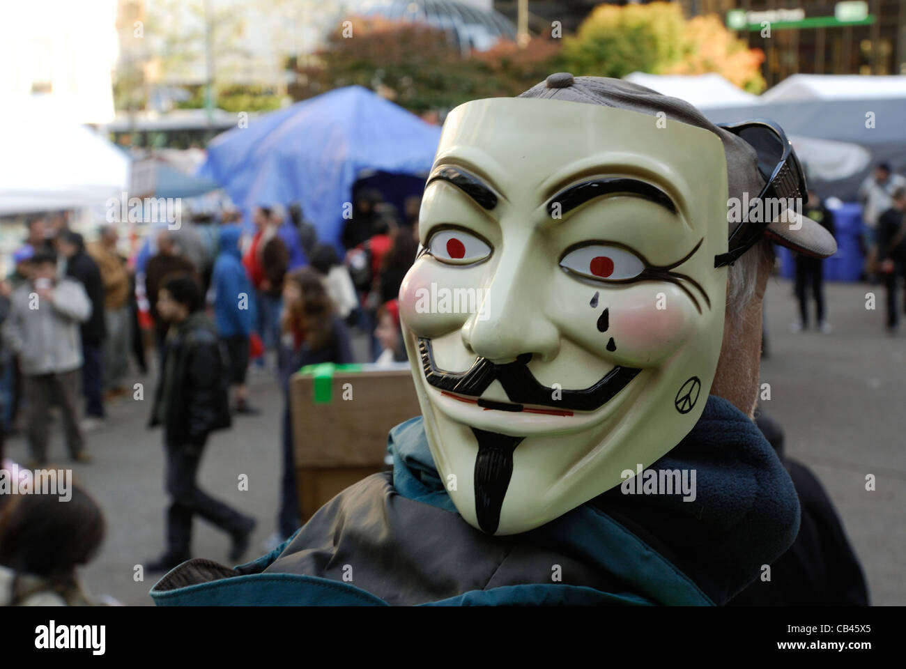 Masque de vendetta rendue populaire par les manifestants de la mouvement occupy. Banque D'Images