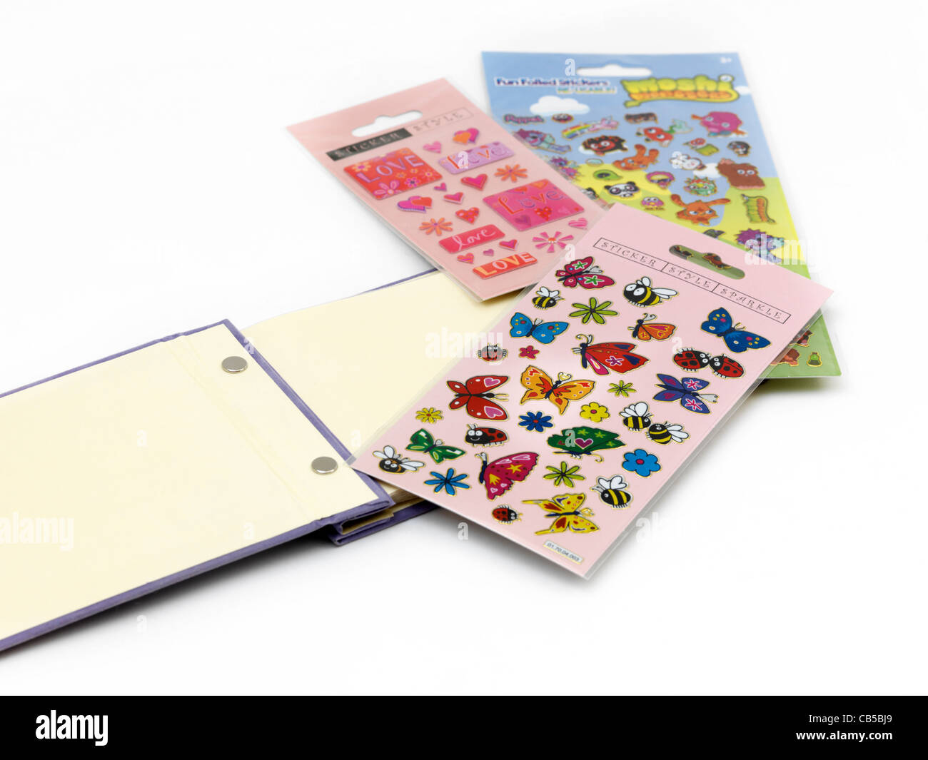 Les papillons, de l'amour et de Moshi Monsters autocollants et Sticker Album Banque D'Images