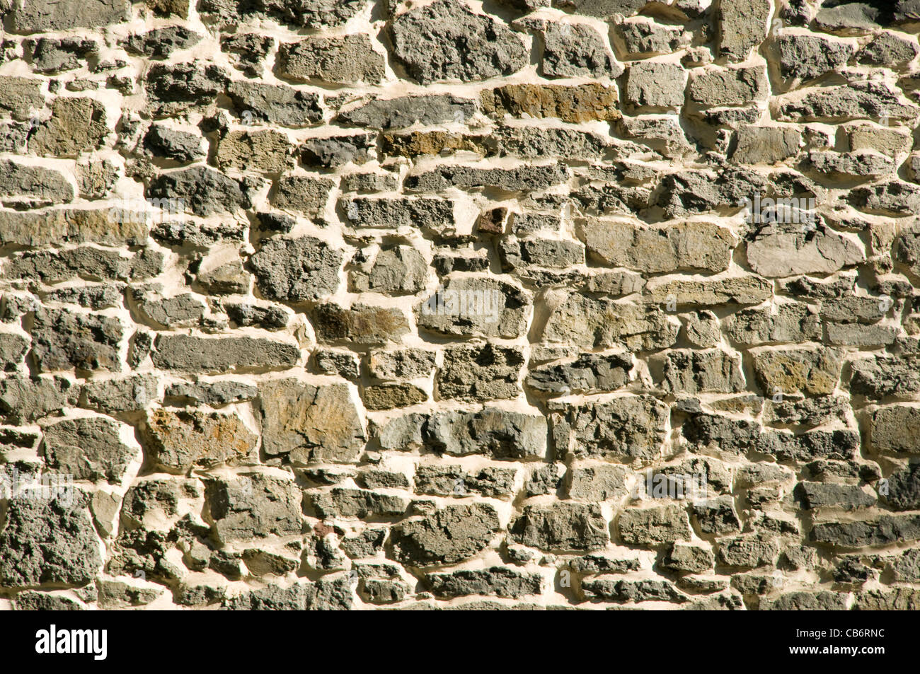 Maçonnerie primitive gris rock stone wall background Banque D'Images
