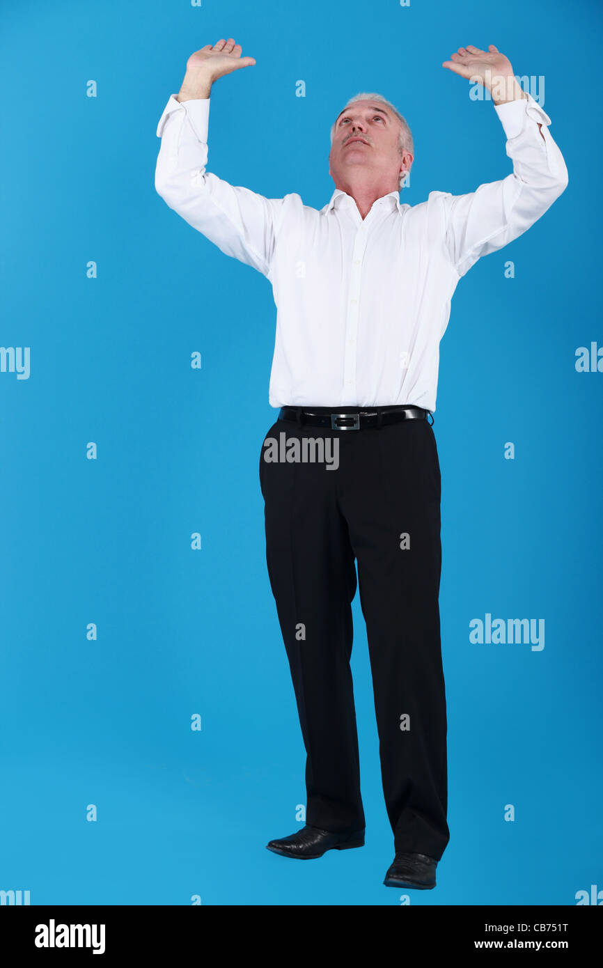 Homme d'affaires, d'atteindre à l'air Banque D'Images