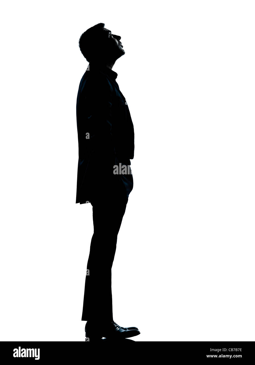 Un homme d'affaires permanent jusqu'à la silhouette pleine longueur en studio isolé sur fond blanc Banque D'Images