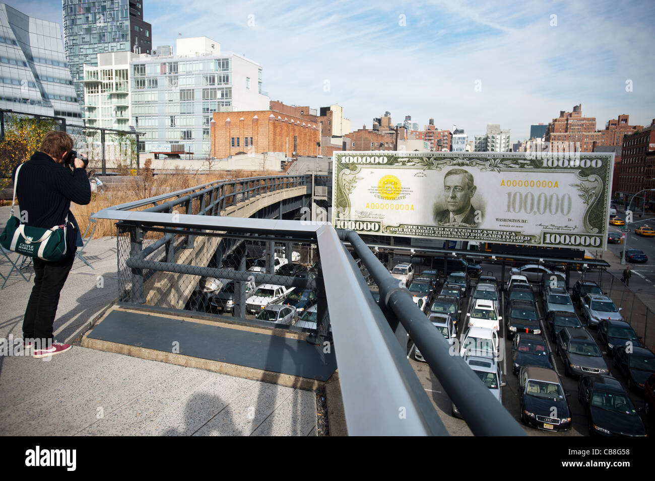 Un panneau le long de la High Line Park à Chelsea à New York afficher 'la première tranche de 100 000 J'ai jamais fait' Banque D'Images