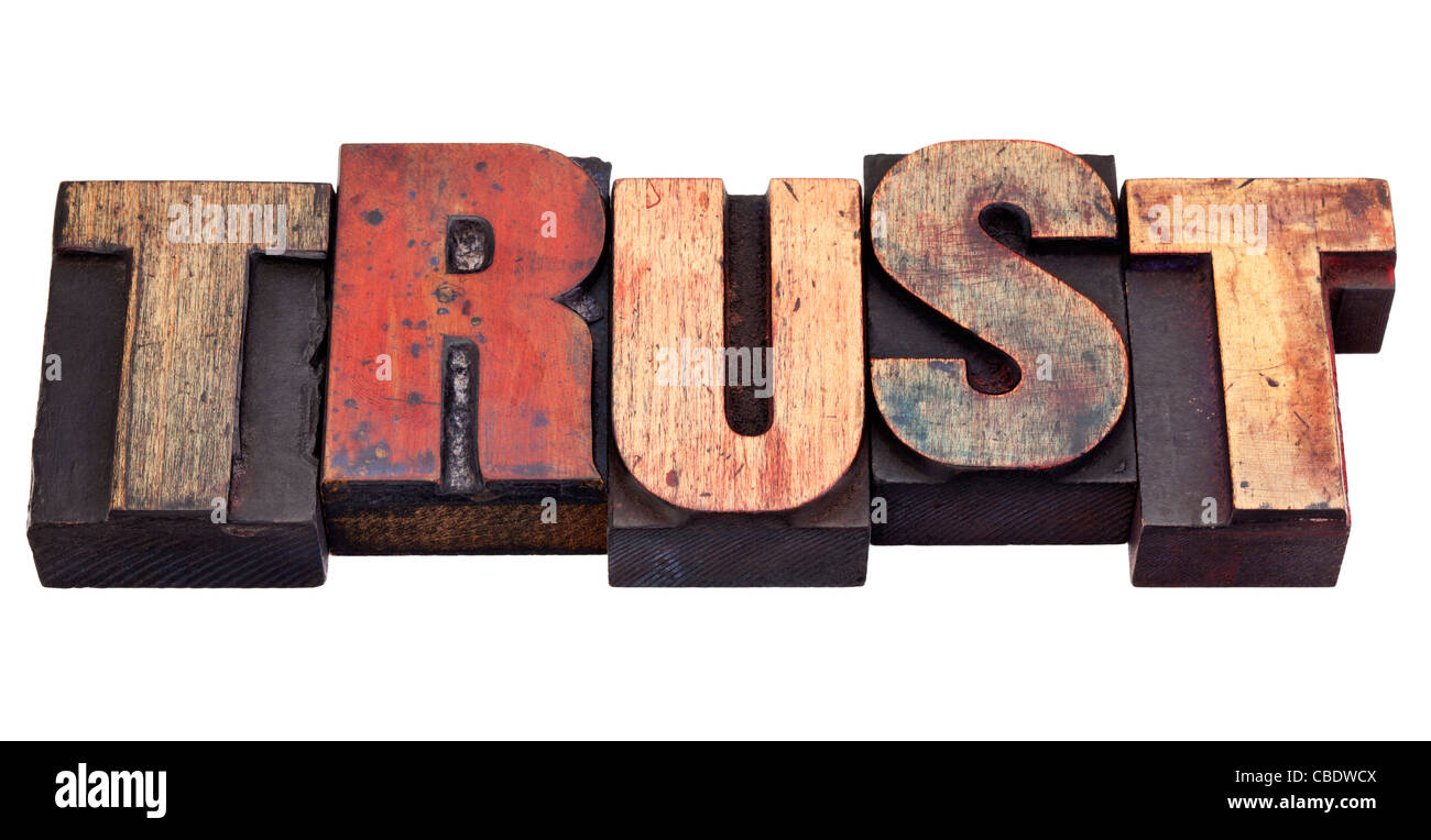 Trust mot dans vintage grunge typographique en bois blocs, isolated on white Banque D'Images