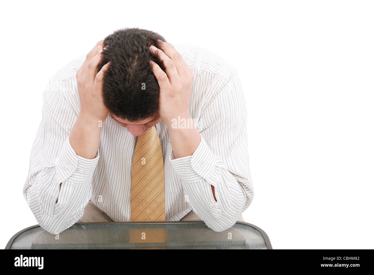 Close up of businessman holding hands up à face Banque D'Images
