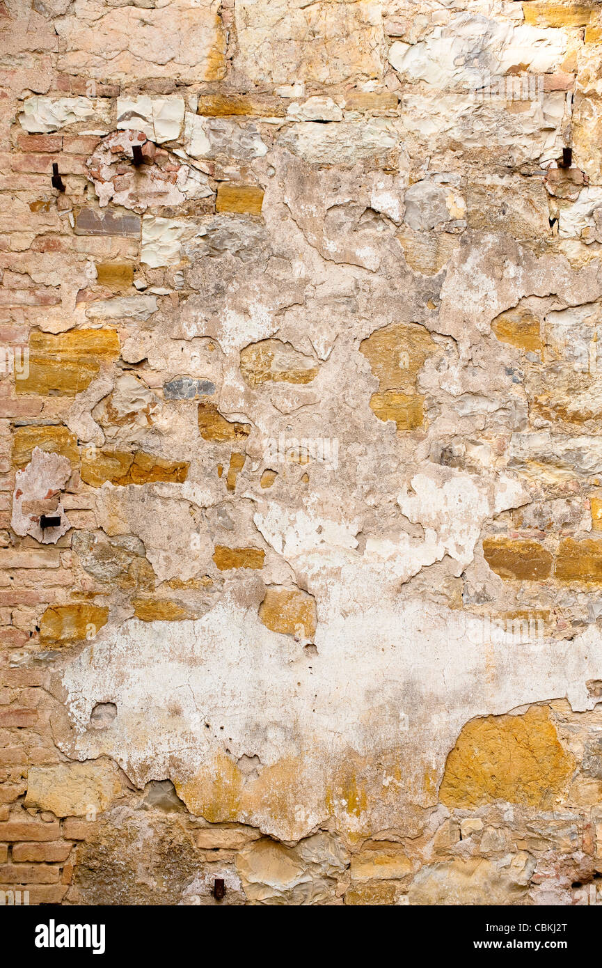 Texturé, mur rustique sur l'ancien bâtiment en Toscane, Italie Banque D'Images