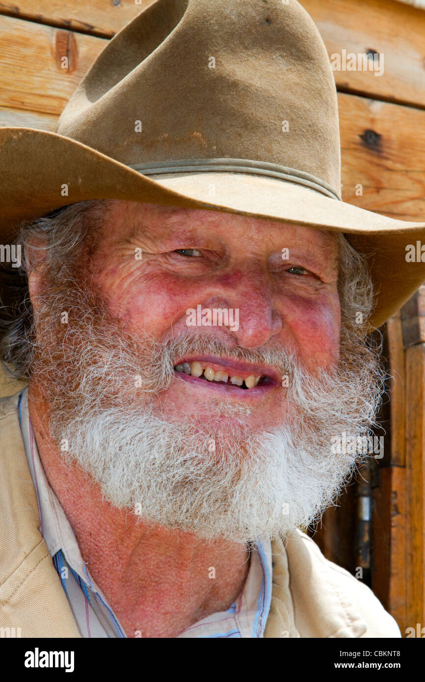 Muleskinner équitation sur un chariot couvert dans la ville de rochers Réserve Nationale et State Park dans le comté de Cassia, Florida, USA. M. Banque D'Images