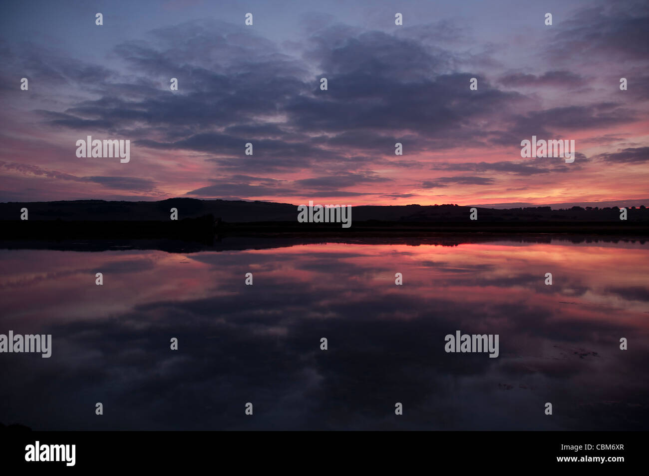 Coucher du soleil à l'horizon Cuckmere Valley Banque D'Images