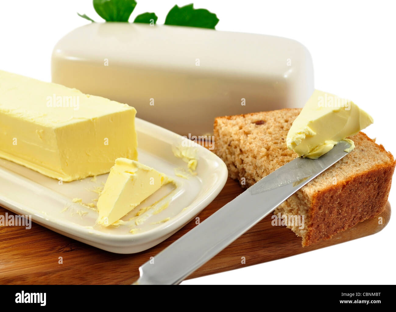 Du beurre et du pain avec un couteau Banque D'Images