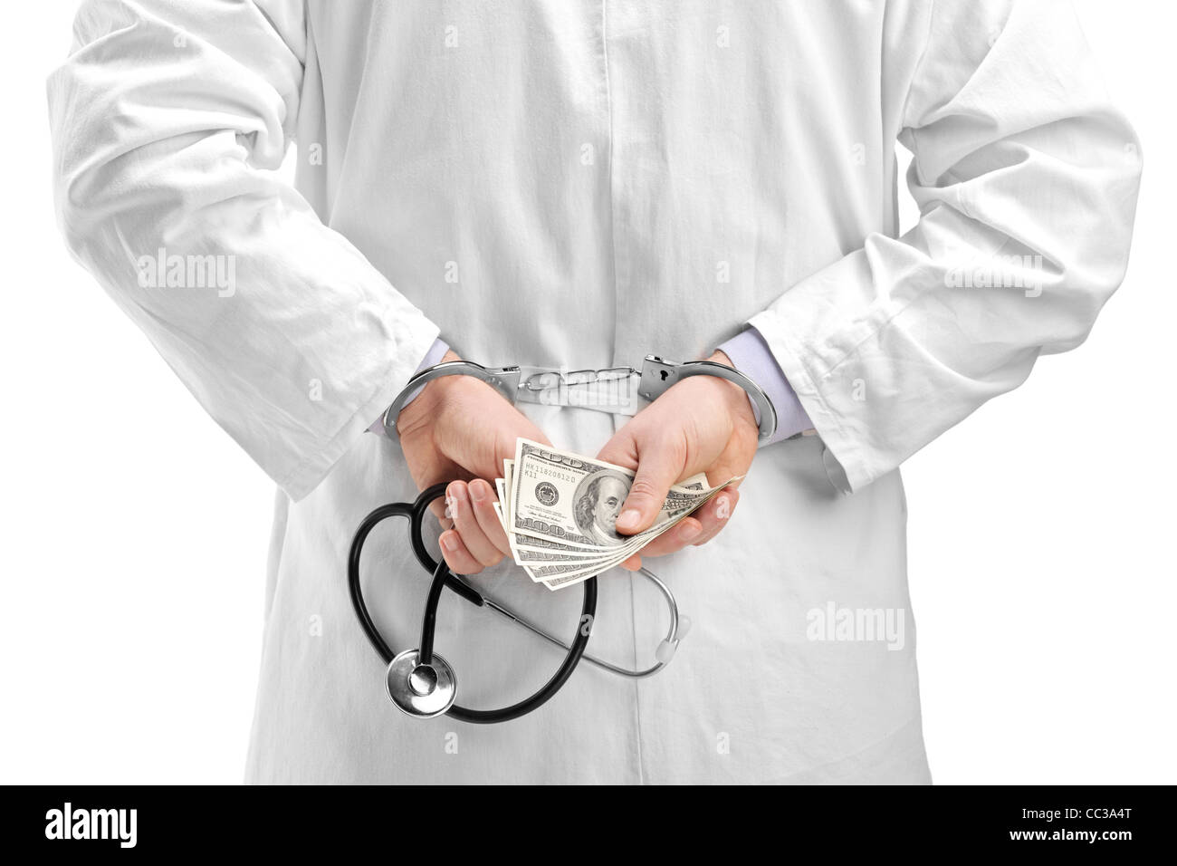 Un médecin avec des billets en dollars et des menottes Banque D'Images