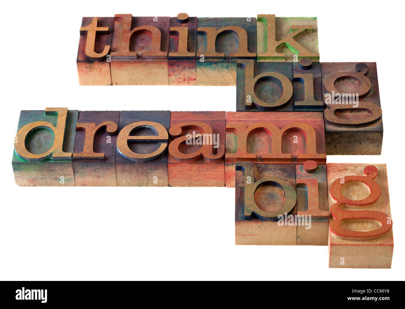 Pensez grand, rêver grand - mots en typographie vintage blocks, tachés par les encres de couleur, isolated on white Banque D'Images
