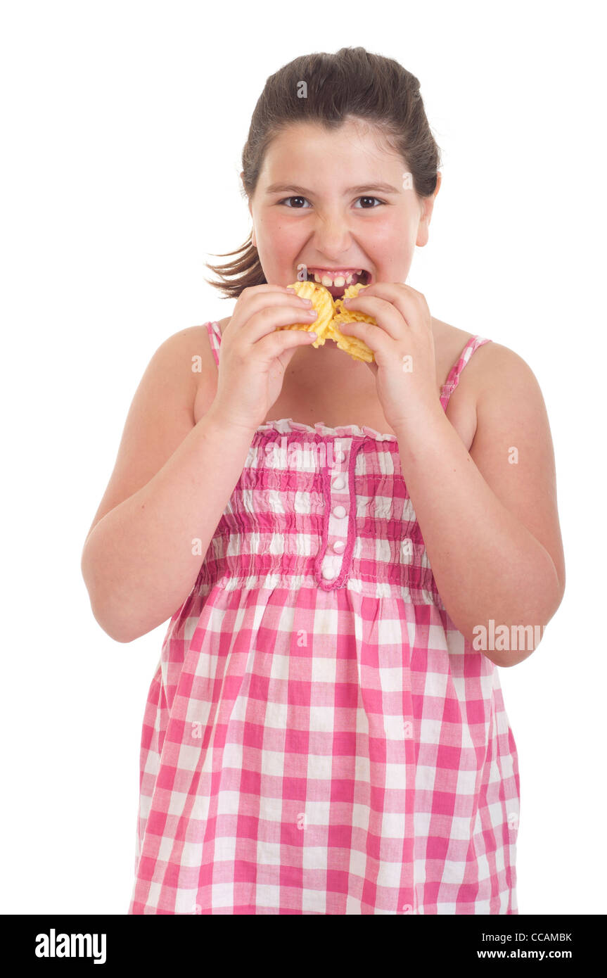 Girl eating chips Banque D'Images