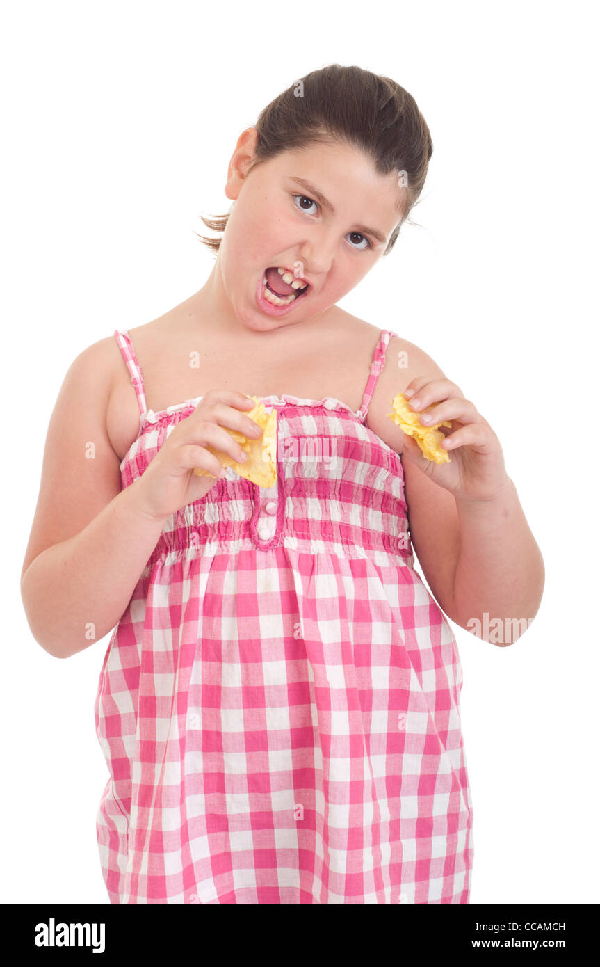 Girl eating chips Banque D'Images