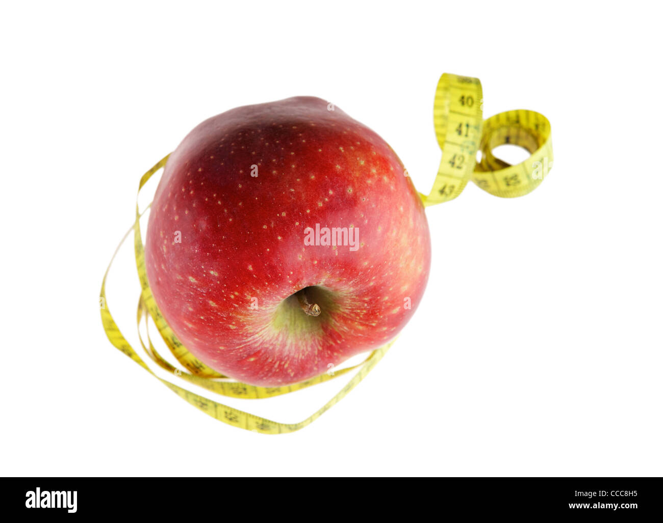Ripe red apple avec un ruban à mesurer Banque D'Images