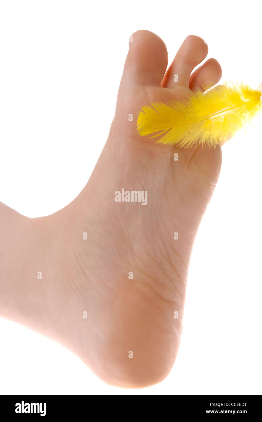 Pied Chatouillement par une plume Banque D'Images