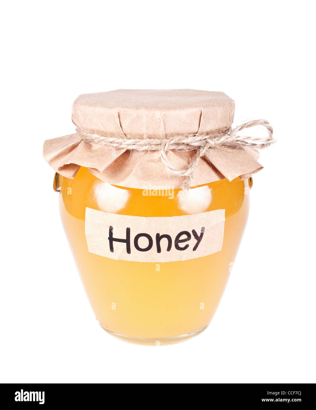 Pot de miel en verre isolé sur fond blanc Banque D'Images