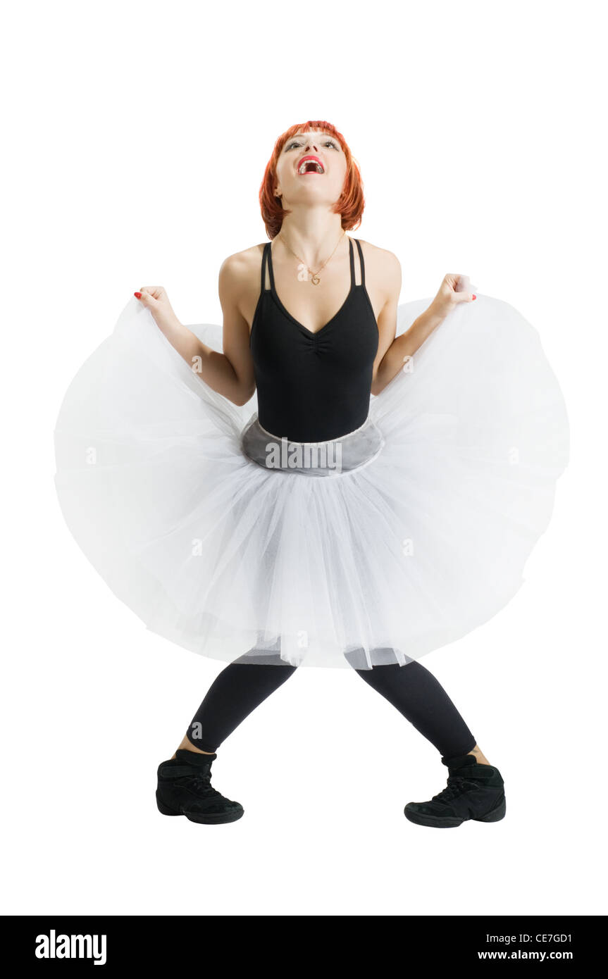 Danseur vêtu de blanc tutu effectuant sur fond uni Banque D'Images