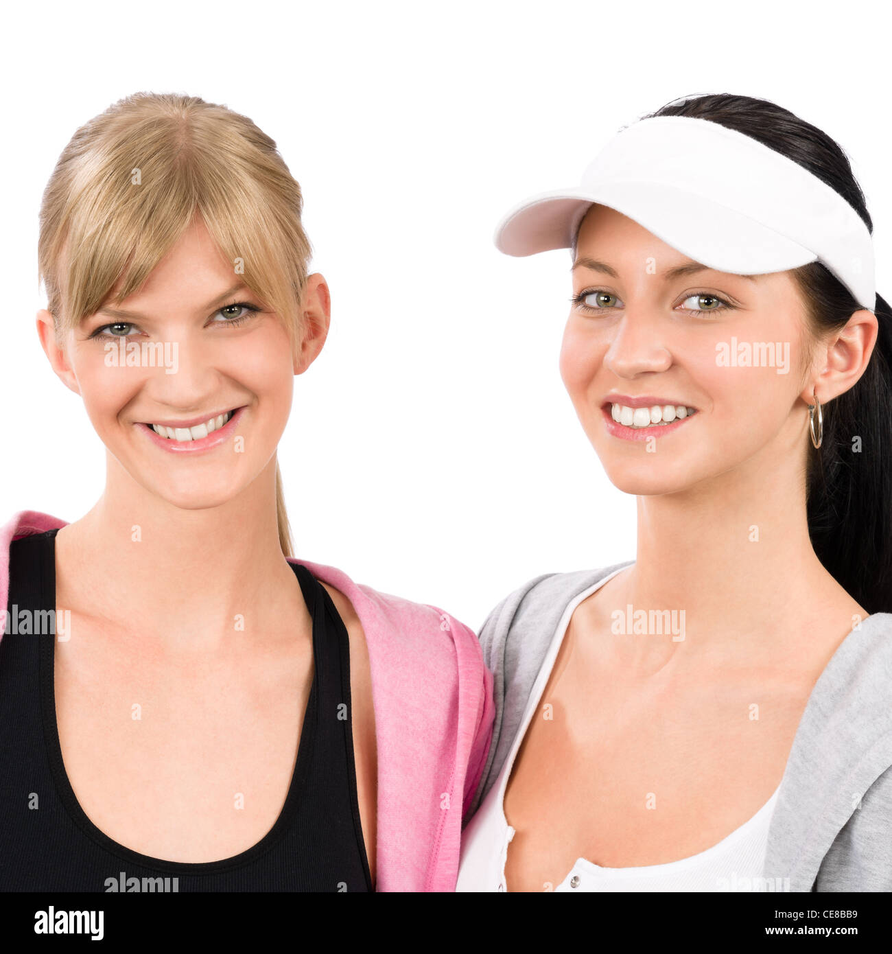 Deux femmes tenue sport amis smiling portrait isolé Banque D'Images