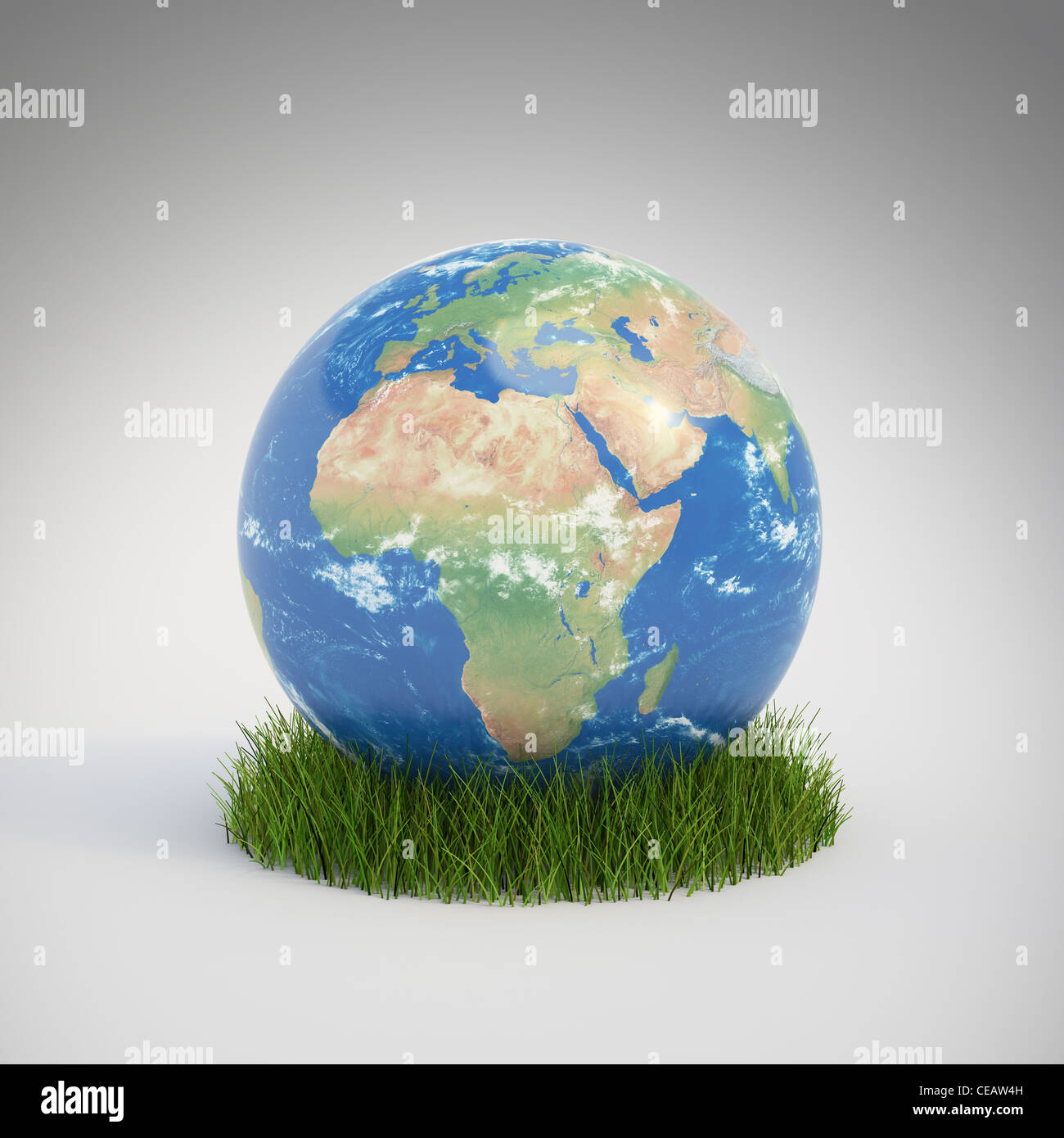 Globe terrestre de plus en plus d'un patch d'herbe - ecology concept Banque D'Images