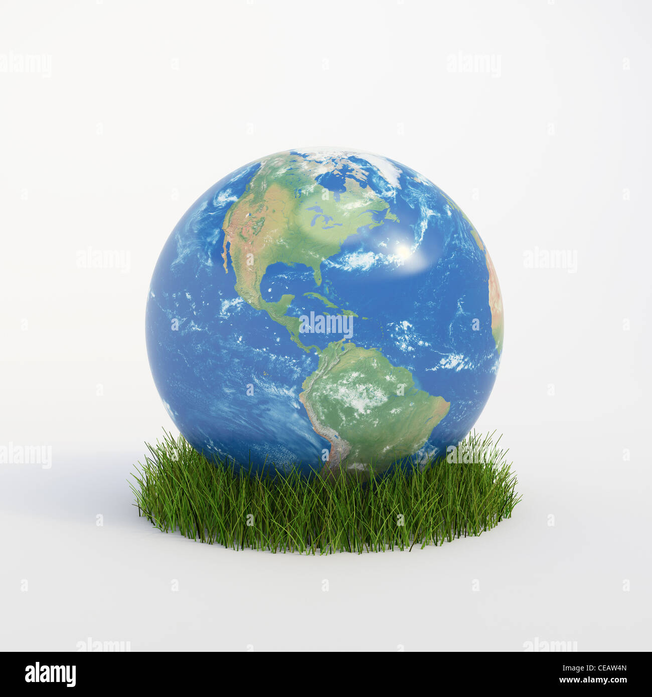 Globe terrestre de plus en plus d'un patch d'herbe - ecology concept Banque D'Images