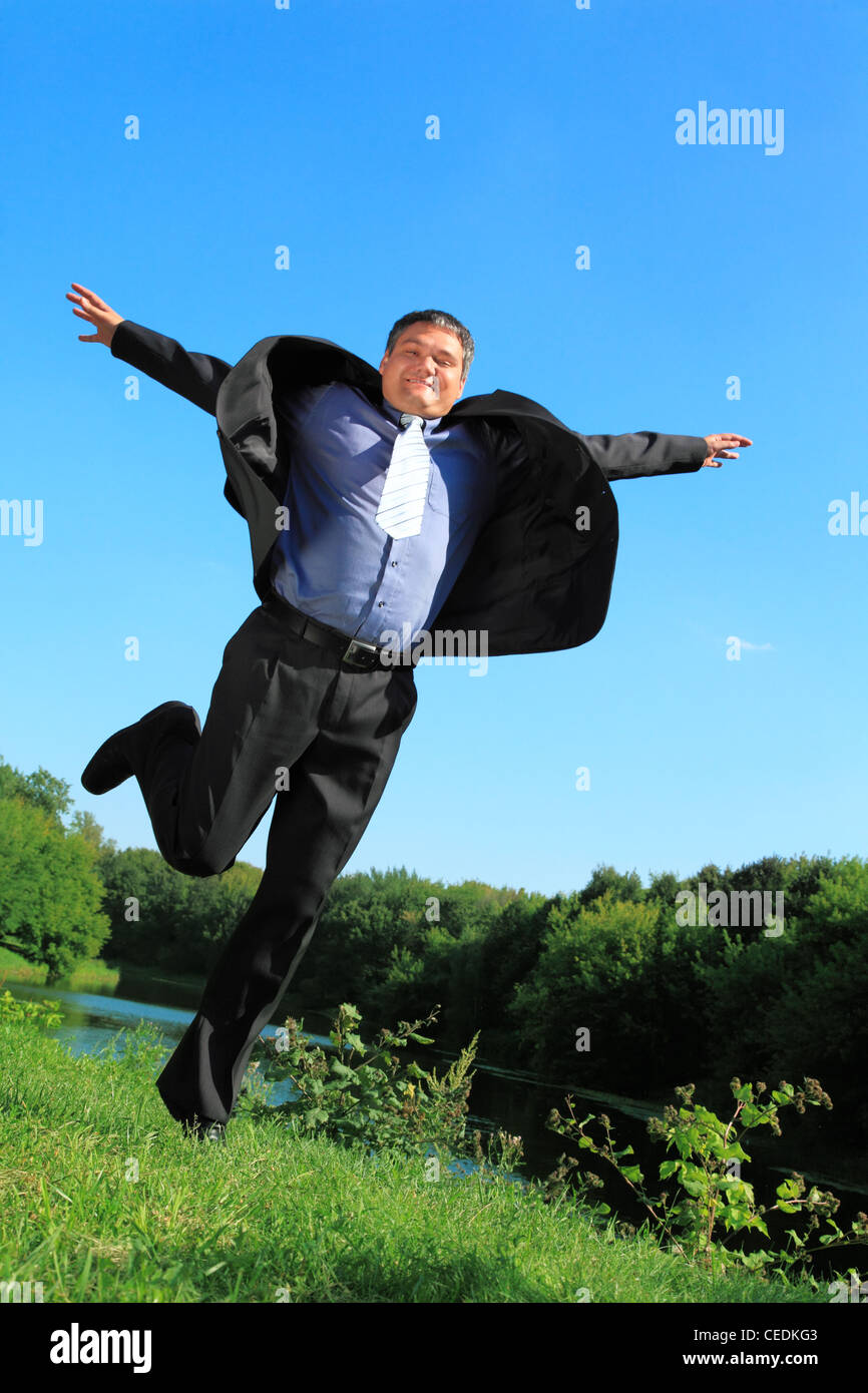 Homme d'affaires de vol en été en plein air corps complet Banque D'Images