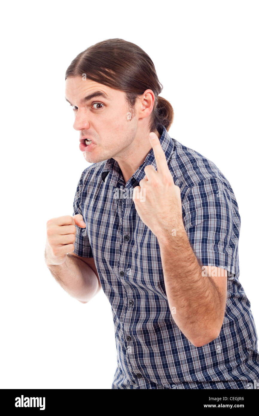 Jeune homme agressif, isolé sur fond blanc. Banque D'Images