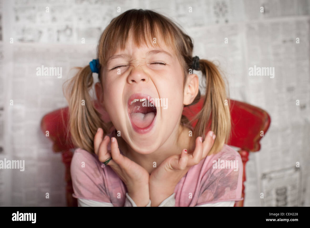 Portrait of Girl with pigtails laughing Banque D'Images