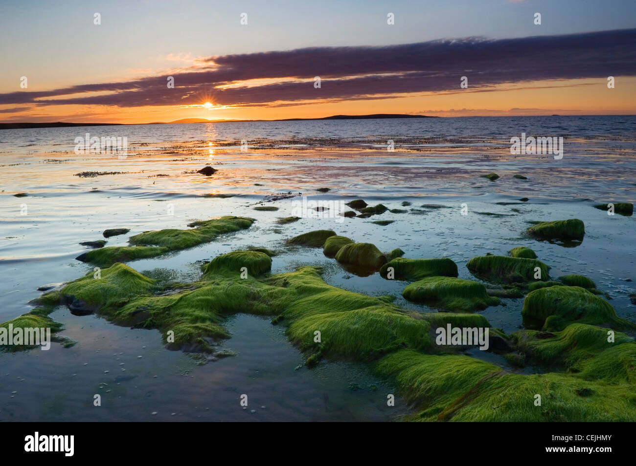 Coucher du soleil à Les Sables d'Mussetter sur l'île d'Eday, îles Orcades, en Écosse. Banque D'Images