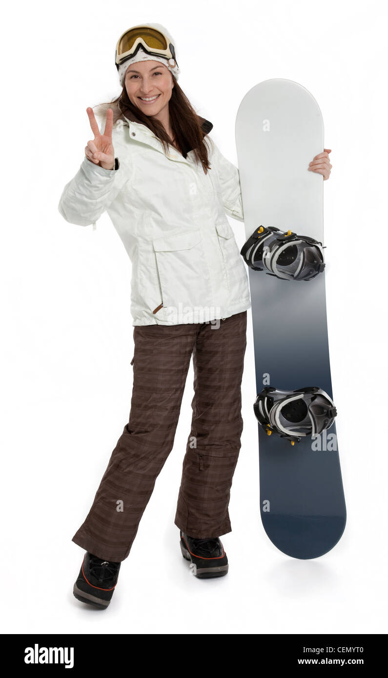Photo pleine longueur de Pretty woman holding snowboard sur fond blanc. Banque D'Images