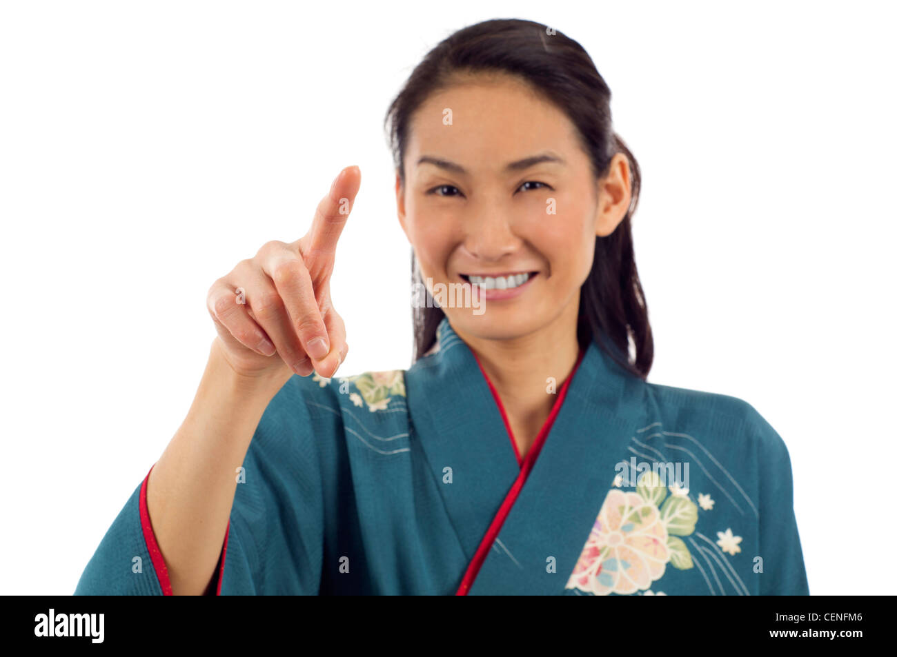 Kimono japonais femme en pointant le doigt sur le bouton virtuel imaginaire isolated over white background Banque D'Images