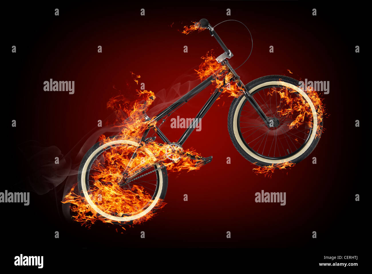 Vélo en feu sur fond rouge foncé Photo Stock - Alamy
